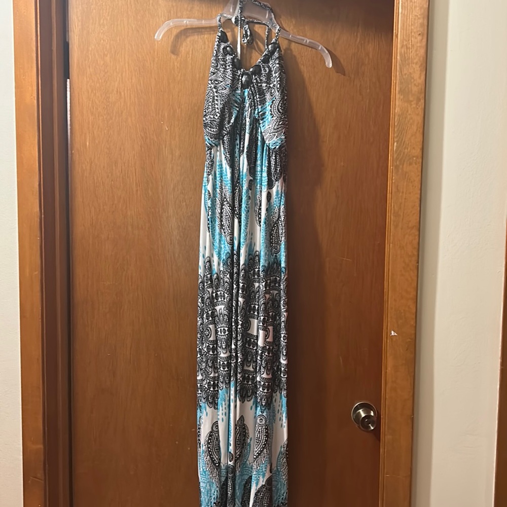Turquoise, black, and white halter maxi dress.